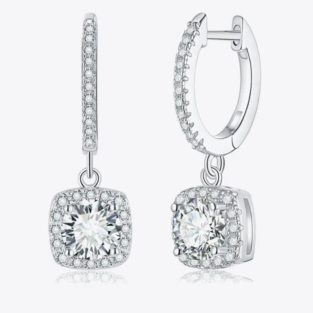 Hanging silver earrings with stone.